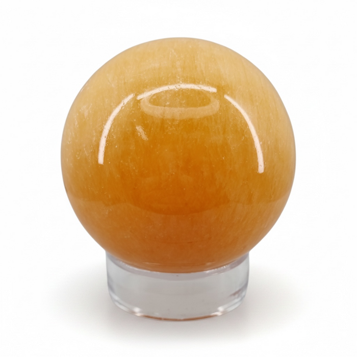 Orange sphere with a clear base on a white background