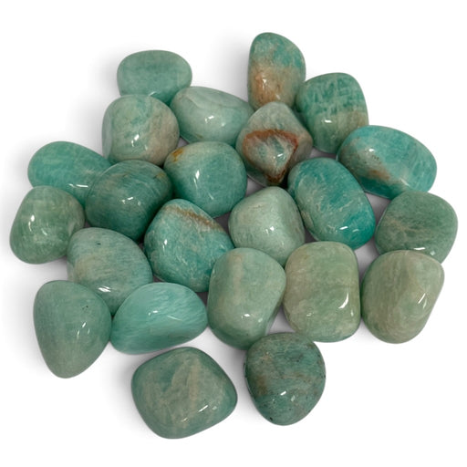 Kindred Crystal Collective — Amazonite Tumbled 2–2.5cm, polished sea-green and turquoise stones with creamy streaks and occasional earthy patches on a white background.