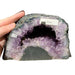 Kindred Crystal Collective — Amethyst Cave, front view of natural amethyst cave showing sparkling violet druzy crystal interior within rugged natural outer shell