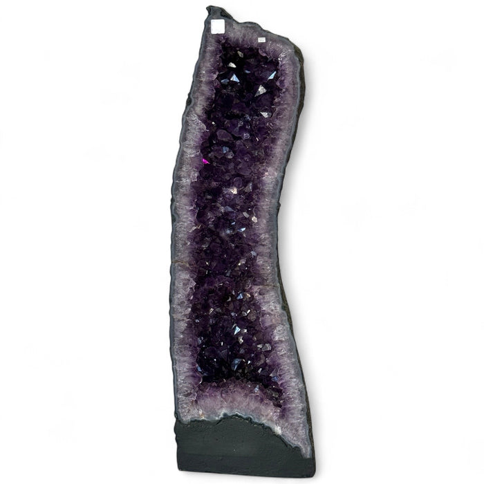 Kindred Crystal Collective — Amethyst Cave Uruguayan, close-up detail of rich saturated violet amethyst crystal formation inside Uruguayan cave