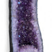 Kindred Crystal Collective — Amethyst Cave Uruguayan, interior view of sparkling deep violet Uruguayan amethyst crystal points within polished cave
