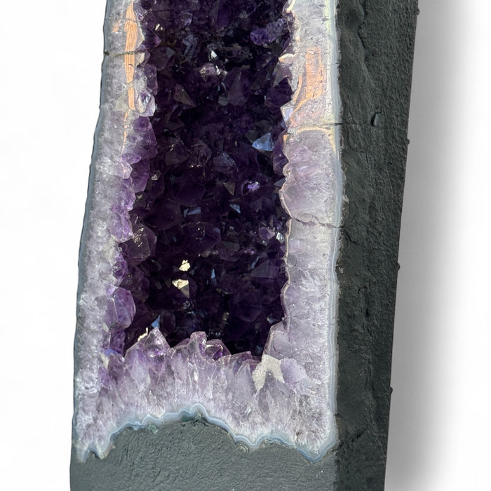 Kindred Crystal Collective — Amethyst Cave With Calcite Inclusion, close-up detail of natural calcite inclusion within rich violet Uruguayan amethyst cave