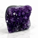 Kindred Crystal Collective — Amethyst Cluster, large deep violet natural Amethyst druzy cluster on dark basalt matrix displayed on white marble surface, angled front view