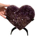 Kindred Crystal Collective — Amethyst Cluster Heart, natural amethyst cluster carved into heart shape with deep violet druzy crystal surface on metal display stand, 24.5cm tall