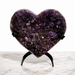 Kindred Crystal Collective — Amethyst Cluster Heart, natural amethyst cluster carved into heart shape with deep violet druzy crystal surface on metal display stand, 24.5cm tall