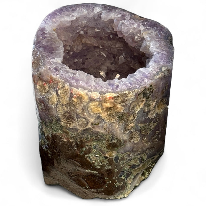 Kindred Crystal Collective — Amethyst Geode Pair, close-up detail of deep violet amethyst druzy crystal points inside natural geode half