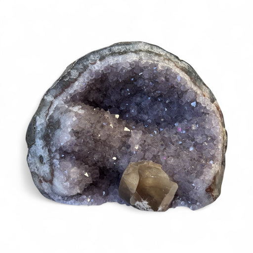 Kindred Crystal Collective — Amethyst Geode With Calcite Inclusion, front view showing contrast between deep violet amethyst crystal points and cream calcite inclusion