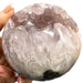 Amethyst pac-man sphere catching light across deep violet crystals, a stunning 1035g healing crystal statement piece