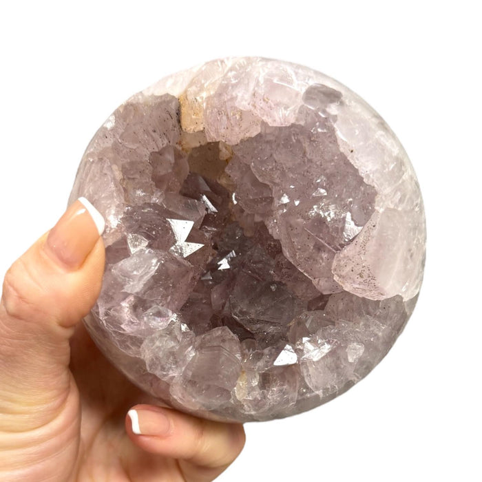 Natural amethyst cluster sphere with open druzy formation, showcasing nature's own sculpture in deep purple for third eye and crown chakra activation