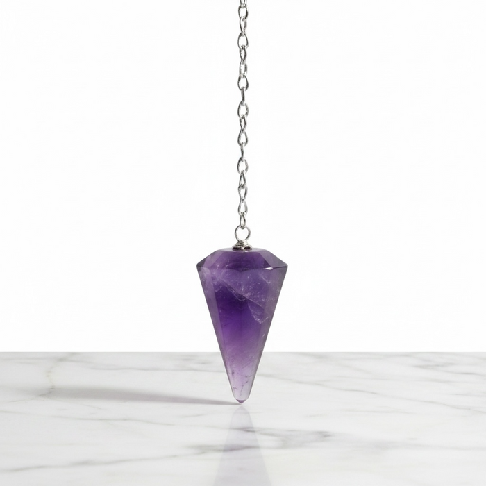 Natural amethyst faceted pendulum in deep purple, used for dowsing, meditation and spiritual clarity