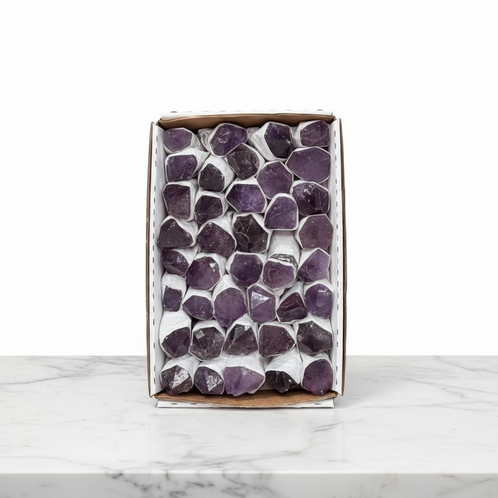 Kindred Crystal Collective — Amethyst Rough Point Boxed, large flat retail box of individually paper-wrapped raw deep purple amethyst points