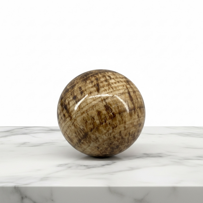 Natural aragonite polished sphere 118g, 4cm diameter, in warm earthy brown and cream tones, for grounding, root chakra and earth connection