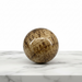Natural aragonite polished sphere 118g, 4cm diameter, in warm earthy brown and cream tones, for grounding, root chakra and earth connection