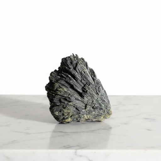 Kindred Crystal Collective — Black Kyanite Feather, raw black kyanite fan specimen with radiating blade-like crystals in feather formation