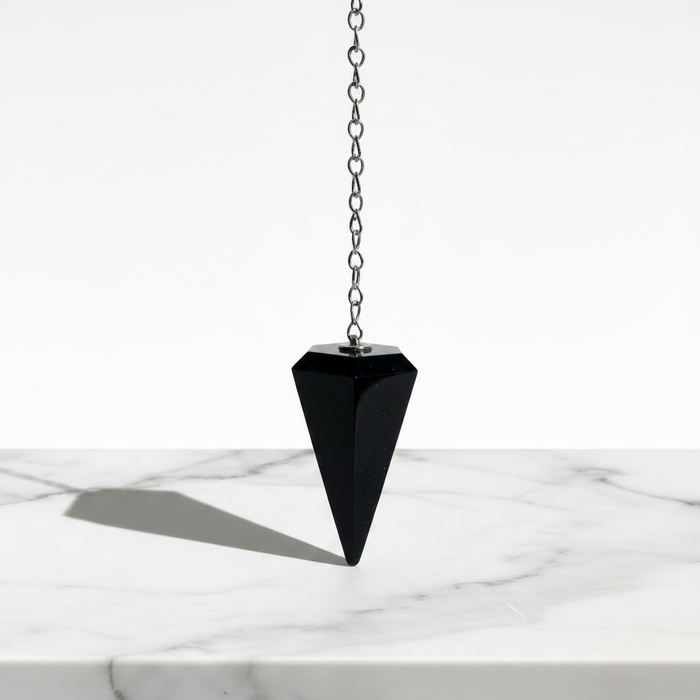 Black obsidian crystal pendulum with mirror-like surface, a powerful protective healing crystal for energy cleansing and grounding