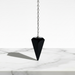 Black obsidian crystal pendulum with mirror-like surface, a powerful protective healing crystal for energy cleansing and grounding