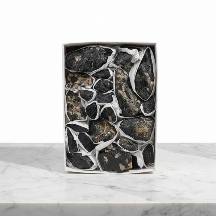 Kindred Crystal Collective — Black Tourmaline Rough Boxed, deep white gift box of chunky raw black tourmaline rough pieces wrapped in plastic