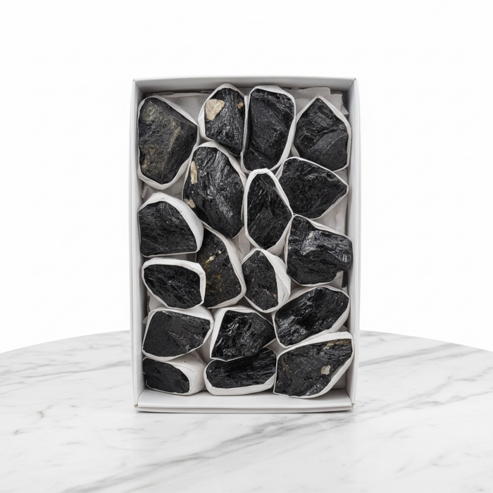 Kindred Crystal Collective — Black Tourmaline Rough Boxed, flat retail display box of raw black tourmaline rough pieces individually wrapped