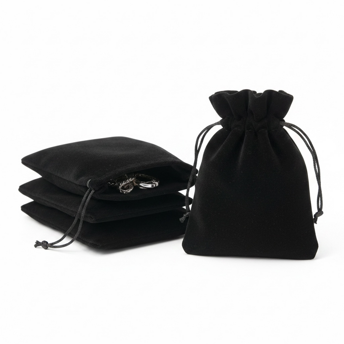 Black velvet drawstring bags on a white background