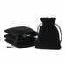 Black velvet drawstring bags on a white background