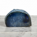 Kindred Crystal Collective - Blue Agate tealight holder carved from a natural geode half, showing deep teal and midnight blue banding with a smooth polished interior.