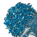 Kindred Crystal Collective — Blue Howlite Chips 500g, vivid turquoise-blue colour-enhanced howlite chips with white matrix, poured from clear bag on white background