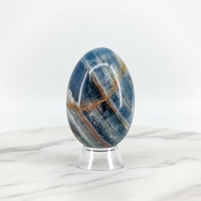 Natural blue onyx crystal egg in deep blue with smooth polished finish, for throat chakra healing, emotional calm and good fortune