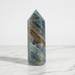 Blue onyx generator 328g with polished pointed apex and deep blue banding, a calming crystal tower for concentration and positive energy