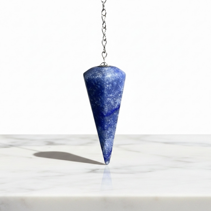 Blue Quartz Pendulum crystal on white background — soft blue translucent stone