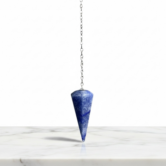 Blue Quartz Pendulum crystal on white background — soft blue translucent stone
