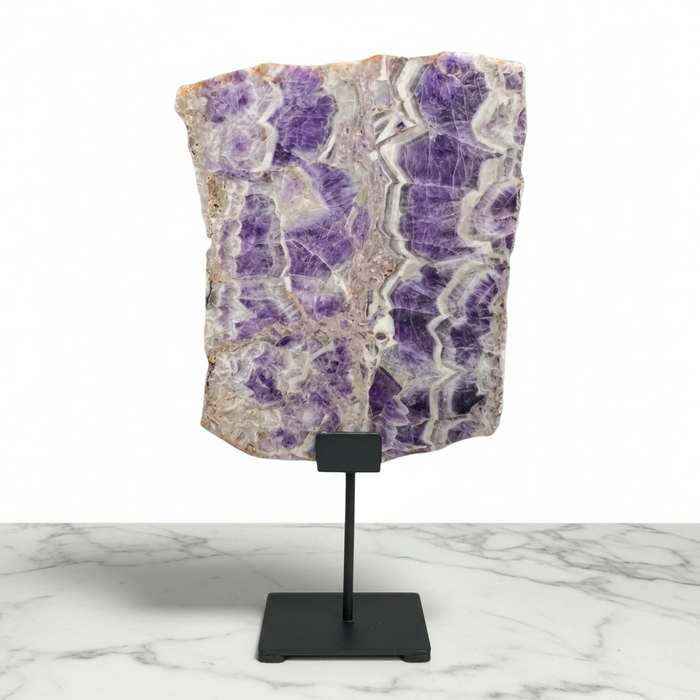 Kindred Crystal Collective — Chevron Amethyst Slab, large banded purple and white amethyst slab on black metal stand, white background