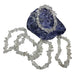 Kindred Crystal Collective — Clear Quartz Chip Bracelets (Pack of 5), five clear-to-cloudy crystal chip bracelets arranged around a dark blue display stone.