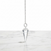 Natural clear quartz faceted pendulum in transparent crystal, used for dowsing, manifestation and crown chakra healing