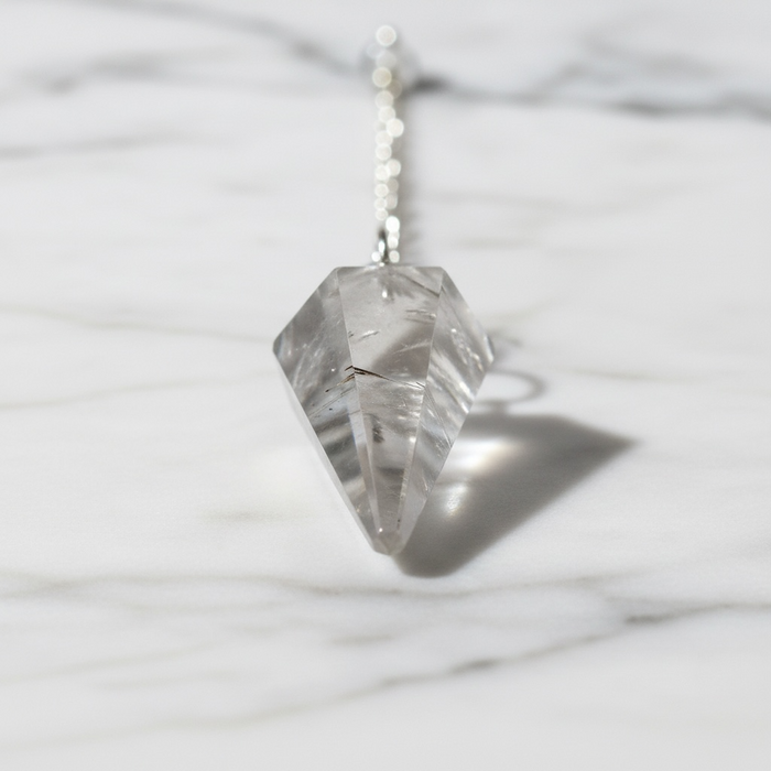 Clear quartz crystal pendulum with natural inclusions, a master healer healing crystal for amplification and energetic clarity