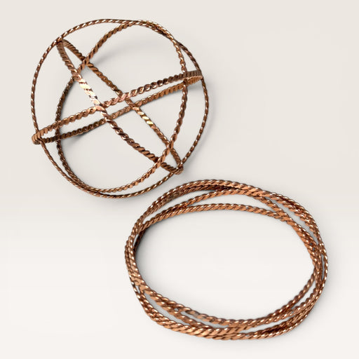 Kindred Crystal Collective — Copper Tensor Field Generator Bracelet 7.5cm, handcrafted twisted copper wire tensor ring shown flat and worn as bracelet, white background