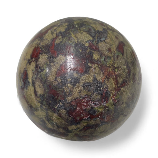 Dragon blood jasper sphere showing striking green and red patterning, a powerful healing crystal for chakra grounding and strength
