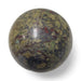 Dragon blood jasper crystal sphere close-up revealing deep red and green natural stone markings, used for courage and protection