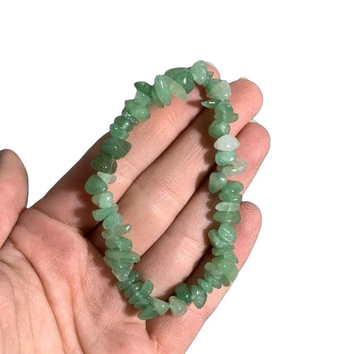 Kindred Crystal Collective — Green Aventurine Chip Bracelets (Pack of 5), five green stone chip bracelets arranged around a white crystal display.