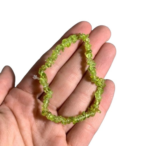 Kindred Crystal Collective — Peridot Chip Bracelets (Pack of 5), polished yellow-green stone chips with translucent detail and a luminous finish.