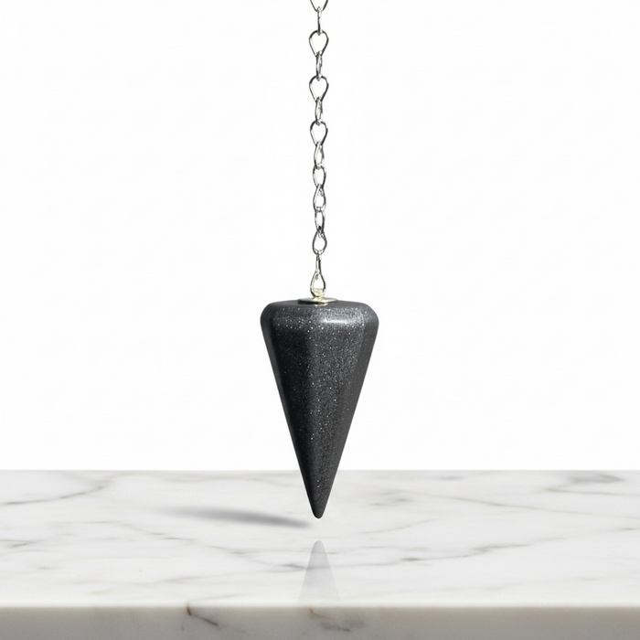 Natural hematite faceted pendulum in metallic silver-grey with mirror-like finish, used for dowsing, root chakra grounding and protection