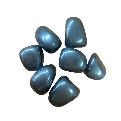 Kindred Crystal Collective — Hematite Tumbled 2–2.5cm, polished steel-grey stones with a reflective metallic sheen on a white background.