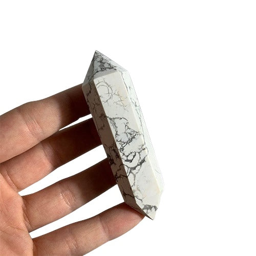 Kindred Crystal Collective — Howlite Double Terminated Wand, polished white Howlite DT wand with bold grey-black veining and dual pointed terminations, hand-held size reference