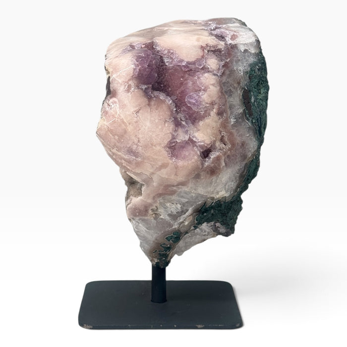 Kindred Crystal Collective — Pink Amethyst Geode on Metal Stand, substantial pink-to-lilac crystal geode displayed on a metal stand with natural mineral variation