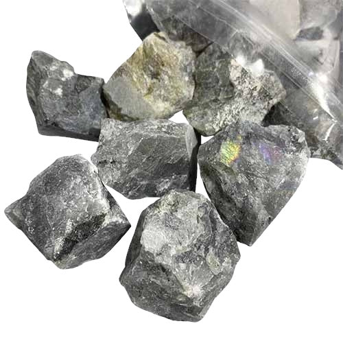 Kindred Crystal Collective — Labradorite Rough 1KG, dark grey raw labradorite chunks spilling from a clear bag on white background.