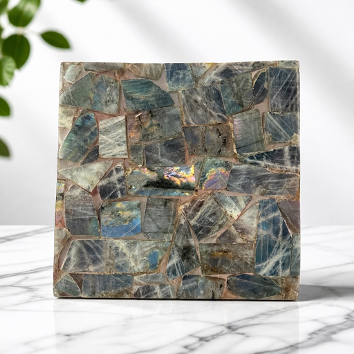 Kindred Crystal Collective — Labradorite Tile Purple Flash, angled view of polished labradorite tile showing shifting blue, gold and purple iridescent flash