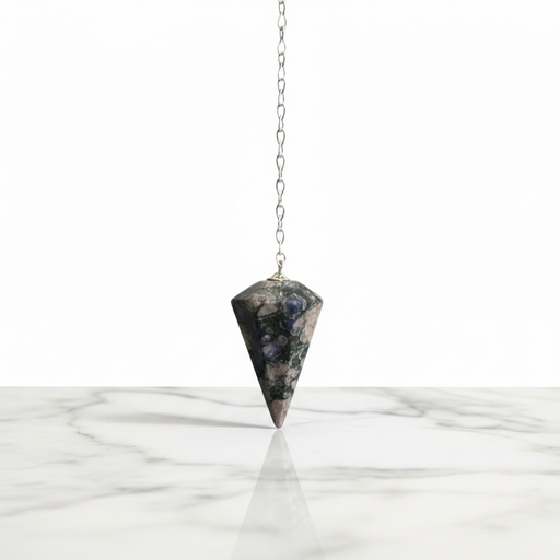 Llanite Pendulum crystal on white background also known as Que Sera, with blue and pink tones