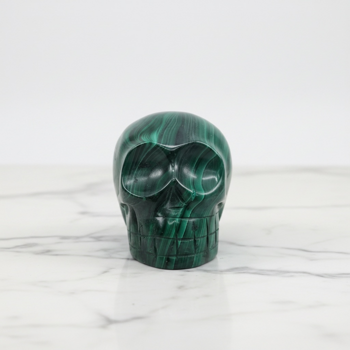 Large malachite crystal skull 278g with deep emerald green swirling formations, a one-of-a-kind collector's piece for spiritual transformation
