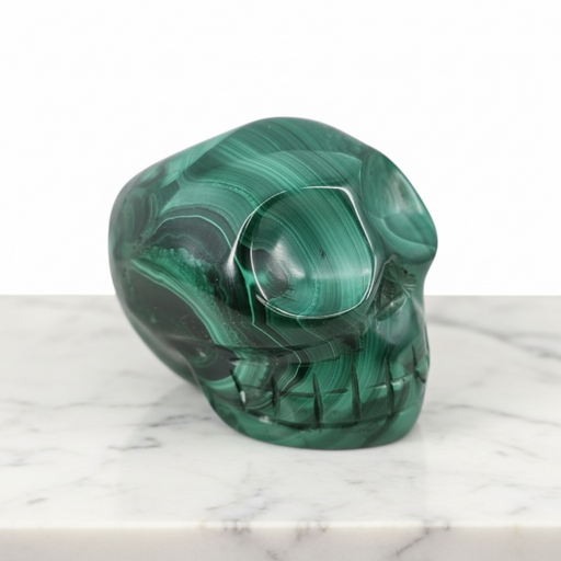 Natural malachite crystal skull 171g in deep emerald green with swirling banded patterns, for transformation and heart chakra healing