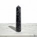 Kindred Crystal Collective — Mystic Merlinite Generator, polished black and grey mottled indigo gabbro generator point, front view on white background