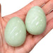Kindred Crystal Collective — New Jade Egg, two polished pale mint-green stone eggs 